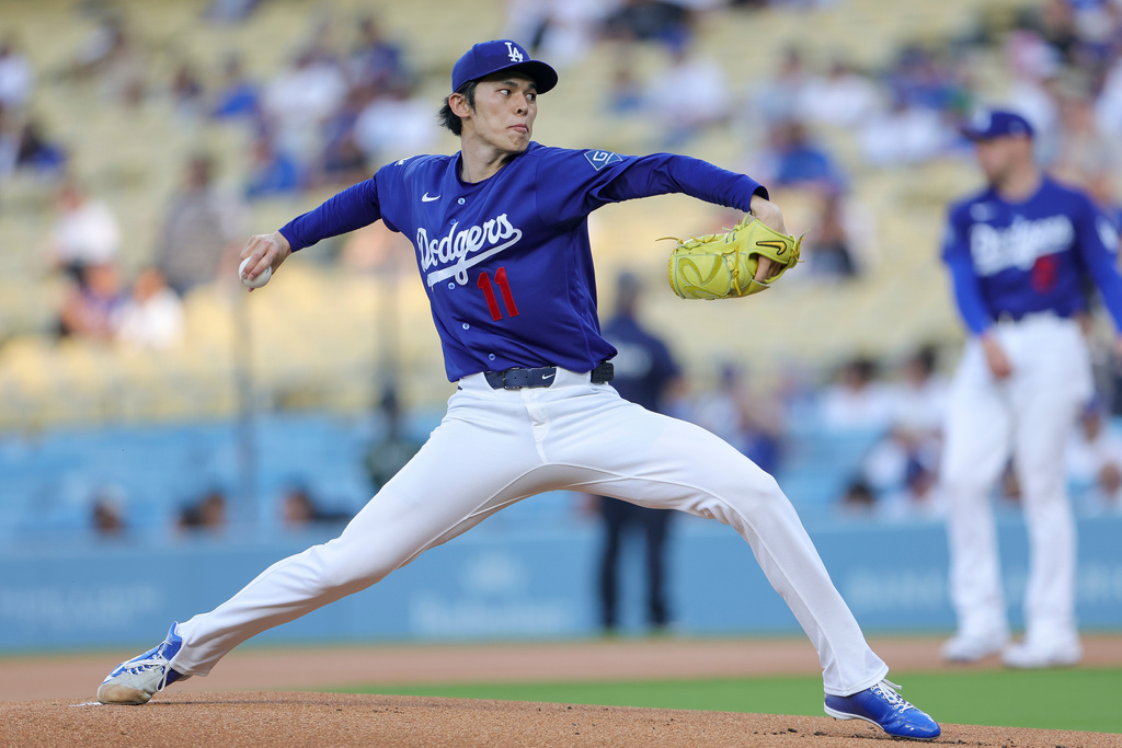 Los Angeles Dodgers starting pitcher Roki Sasaki throws during the first inning of a spring training baseball game against the Los Angeles Angels Monday, March 23, 2026, in Los Angeles. (AP Photo/Ryan Sun)