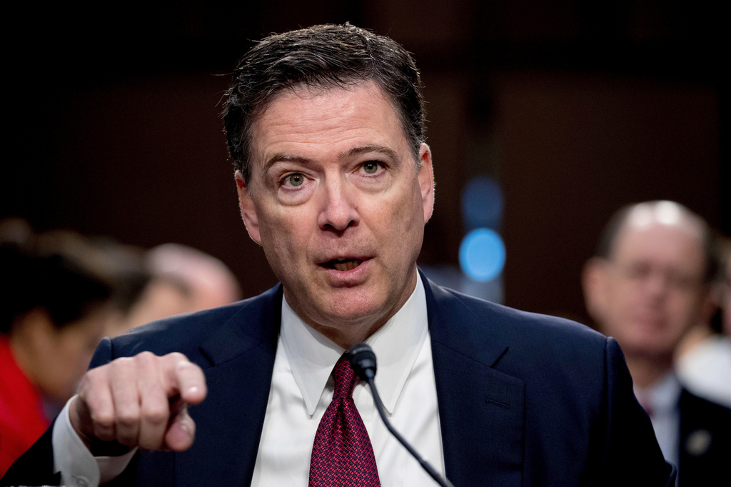 FILE - Former FBI Director James Comey speaks during a Senate Intelligence Committee hearing on Capitol Hill in Washington, June 8, 2017. (AP Photo/Andrew Harnik, File)