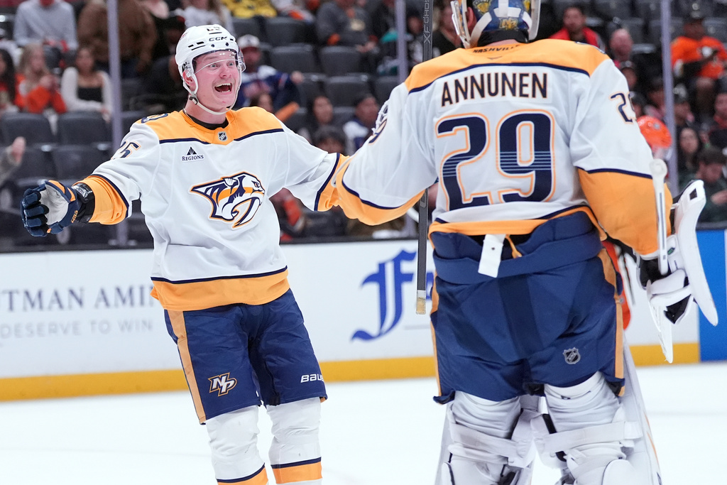 Nashville Predators' right wing Joakim Kemell (25) celebrates with goaltender Justus Annunen (29) after an NHL hockey game against the Anaheim Ducks, Tuesday, April 7, 2026, in Anaheim, Calif.. (AP Photo/Scott Strazzante)
