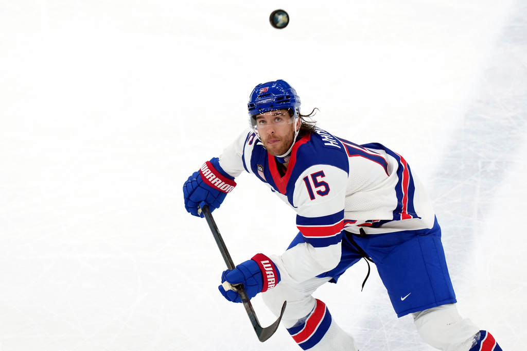 FILE - United States' Noah Hanifin chases the puck during the first period of the men's ice hockey gold medal game against Canada at the 2026 Winter Olympics in Milan, Italy, Feb. 22, 2026. (AP Photo/Carolyn Kaster, File)