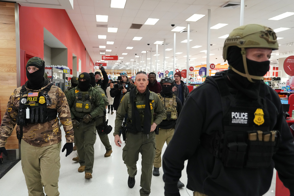U.S. Border Patrol Cmdr. Gregory Bovino walks through a Target store Sunday, Jan. 11, 2026, in St. Paul, Minn. (AP Photo/Adam Gray)
