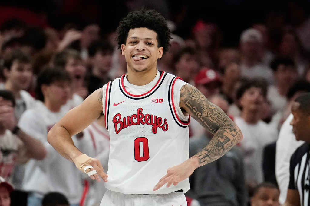 Ohio State guard John Mobley Jr. (0) reacts after a three-point basket in the first half of an NCAA college basketball game against Purdue Sunday, March 1, 2026, in Columbus, Ohio. (AP Photo/Sue Ogrocki)