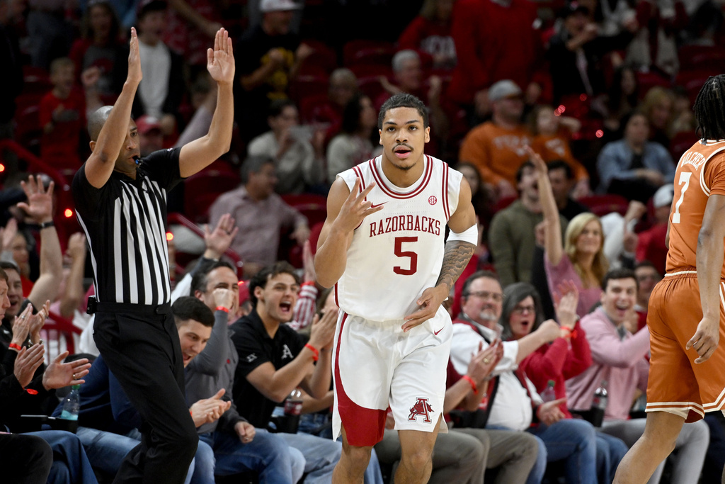 Arkansas guard Darius Acuff Jr. (5) celebrates after hitting a 3-point shot against Texas during the first half of an NCAA college basketball game, Wednesday, March 4, 2026, in Fayetteville, Ark. (AP Photo/Michael Woods)
