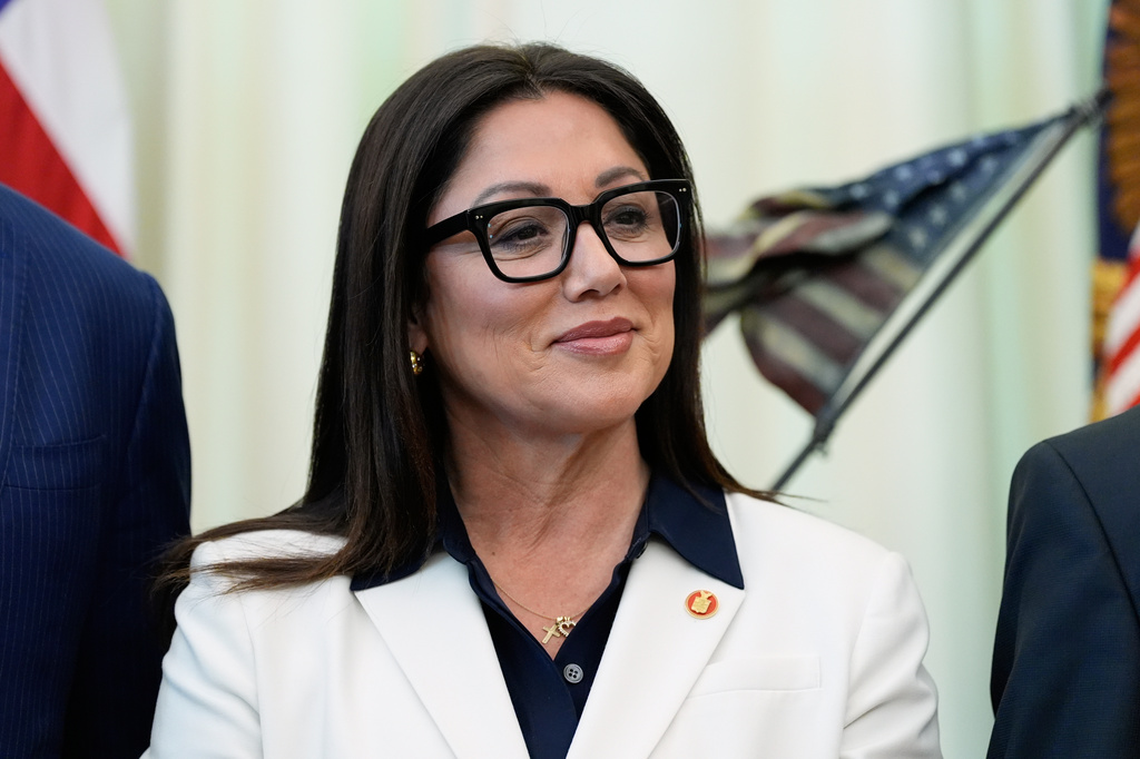 FILE - Labor Secretary Lori Chavez-DeRemer listens as President Donald Trump speaks in the Oval Office of the White House, Oct. 16, 2025, in Washington. (AP Photo/Alex Brandon, File)