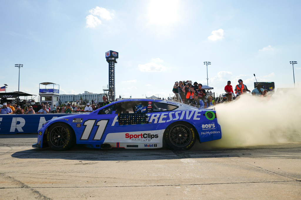 Denny Hamlin celebrates with a burnout after winning the NASCAR All-Star auto race at Dover Motor Speedway, Sunday, May 17, 2026, in Dover, Del. (AP Photo/Derik Hamilton)