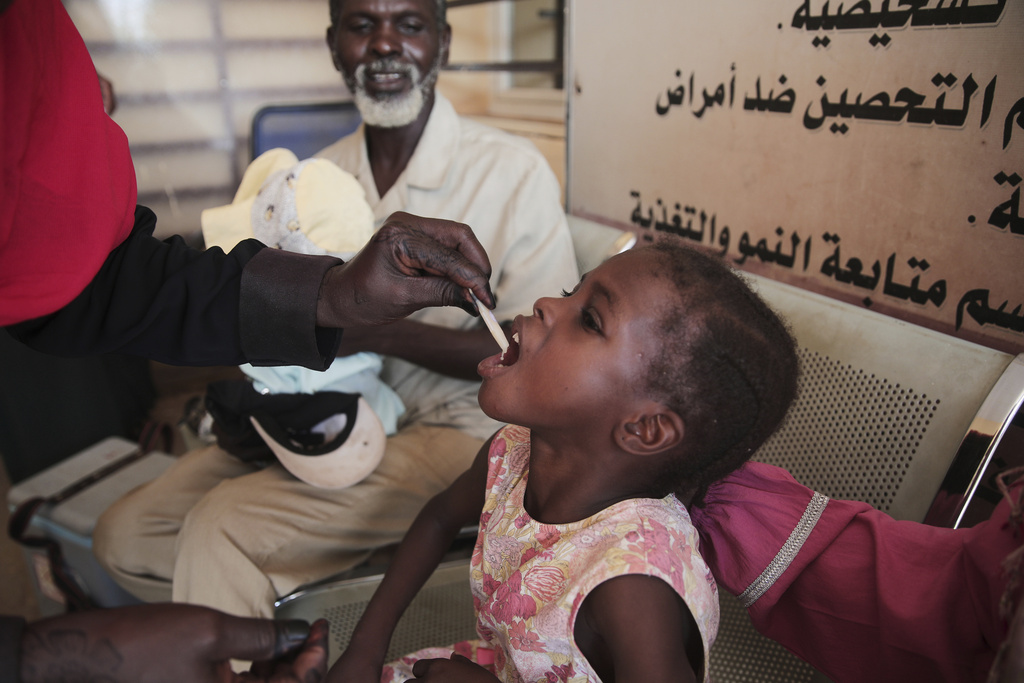 A Sudanese girl receives an oral cholera vaccine during a 10-day vaccination campaign conducted by health ministry workers in Khartoum, Sudan, Wednesday, Aug. 13, 2025. (AP Photo/Marwan Ali)