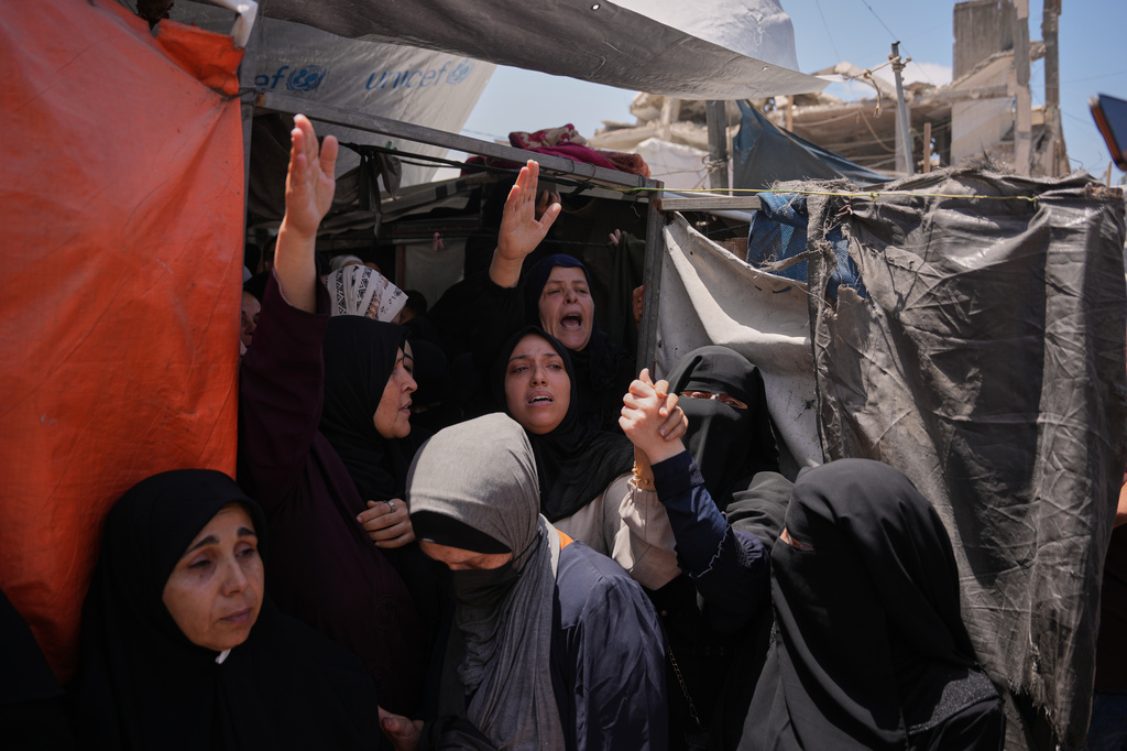 Palestinian women mourn during the funeral of Izz al-Din al-Haddad, the leader of Hamas' Qassam Brigades, and his daughter and wife in Gaza City, Saturday, May 16, 2026. (AP Photo/Abdel Kareem Hana)