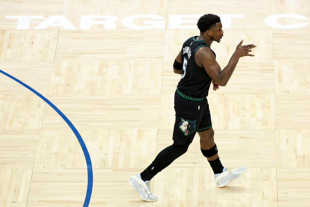 Minnesota Timberwolves guard Anthony Edwards (5) celebrates after scoring a three-point basket during the first half of an NBA basketball game against the Miami Heat, Tuesday, Jan. 6, 2026, in Minneapolis. (AP Photo/Ellen Schmidt)