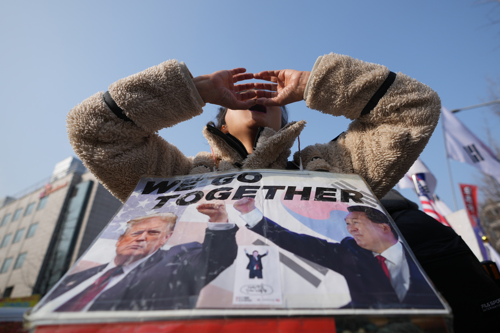 A supporter of former South Korean President Yoon Suk Yeol shouts slogans outside Seoul Central District Court, in Seoul, South Korea, Friday, Jan. 16, 2026. (AP Photo/Lee Jin-man)