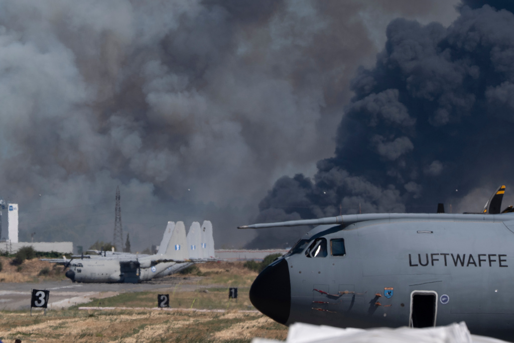 Smoke rises after a Hellenic Air Force F-4 Phantom fighter jet crashed, during the Athens Flying Week airshow at Tanagra Air Force Base, north of Athens, Greece, Saturday, Sept. 5, 2026. (AP Photo)