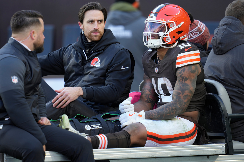 Cleveland Browns running back Quinshon Judkins (10) is carted off the field with an injury against the Buffalo Bills during the first half of an NFL football game in Cleveland, Sunday, Dec. 21, 2025. (AP Photo/Sue Ogrocki)