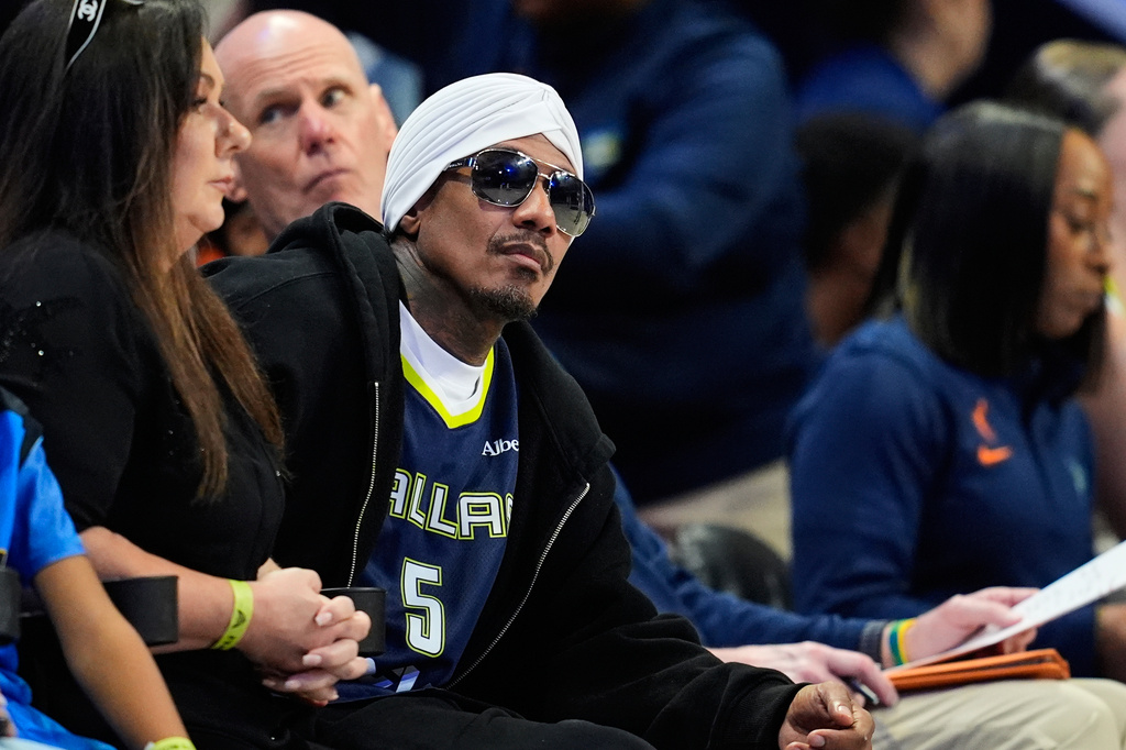 Actor Nick Cannon attends during a WNBA basketball game between the Connecticut Sun and Dallas Wings in Arlington, Texas, Sunday, Aug. 2, 2026. (AP Photo/Tony Gutierrez)