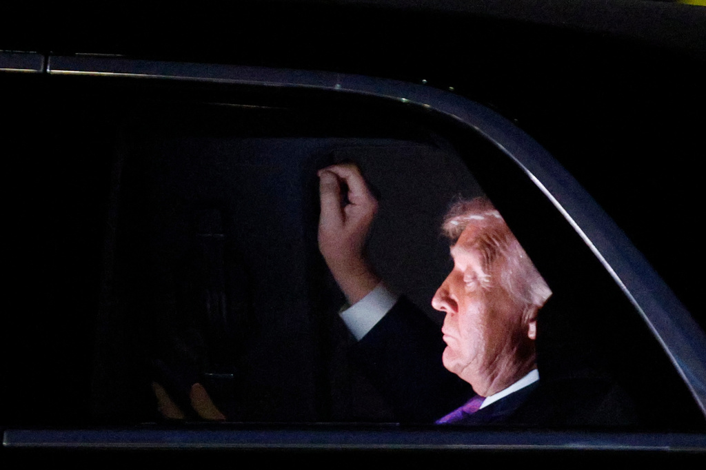 President Donald Trump is seen in his limousine, known as "The Beast," for the motorcade to the White House after his arrival on Air Force One at Joint Base Andrews, Md., Wednesday, March 11, 2026. (AP Photo/Luis M. Alvarez)