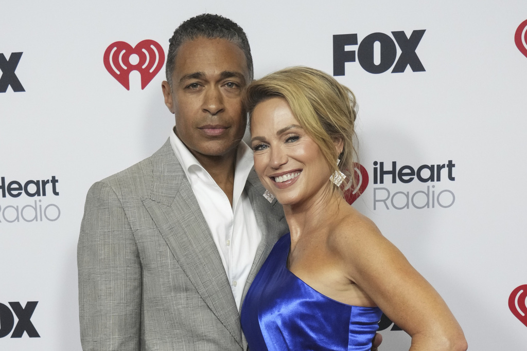 FILE - T. J. Holmes, left, and Amy Robach appear at the iHeartRadio Music Awards in Los Angeles on March 17, 2025. (Photo by Jordan Strauss/Invision/AP, File)