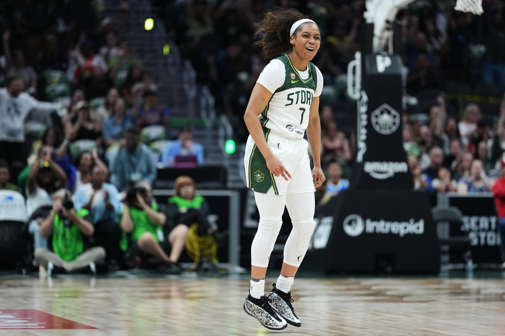 Seattle Storm guard Zia Cooke reacts after making a basket against the Connecticut Sun during the first half of a WNBA basketball game, Friday, May 22, 2026, in Seattle. (AP Photo/Lindsey Wasson)