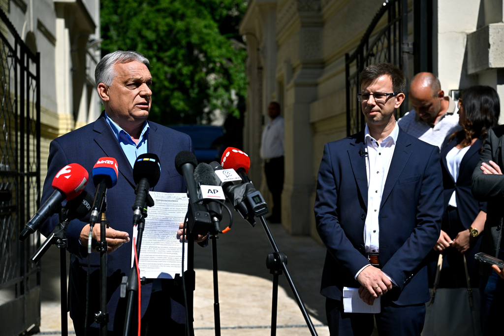 Former Hungarian Prime Minister and Chairman of the Fidesz party Viktor Orban, left, and new faction leader of the party Janos Boka hold a press conference in front of the Fidesz headquarters in Lendvay Street in Budapest, Hungary, Wednesday, July 22, 2026. (Robert Hegedus/MTI via AP)