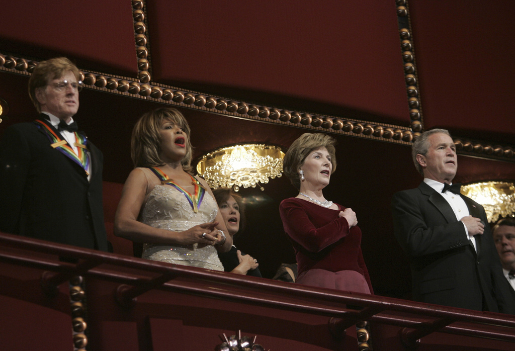 President Bush, right, and first lady Laura Bush, second from right, stand with actor Robert Redford, left, and singer Tina Turner at the Kennedy Center Honors Gala in Washington on Dec. 4, 2005. (AP Photo/Evan Vucci, File)