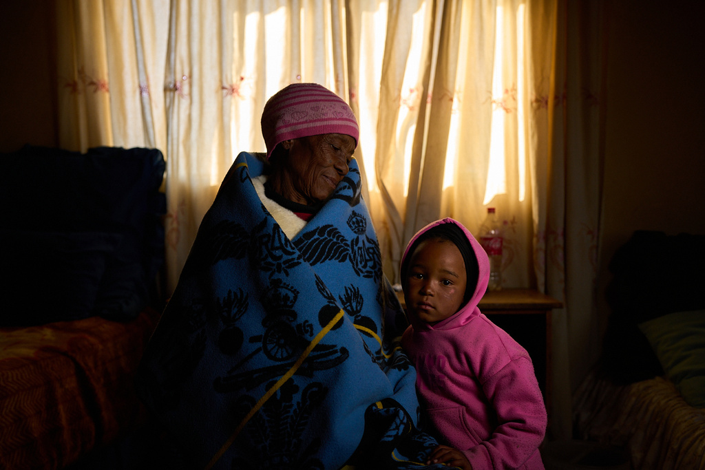 Malerata Tau, who is HIV positive, poses for a portrait with her granddaughter in Mafeteng, Lesotho, July 12, 2025. (AP Photo/Bram Janssen)