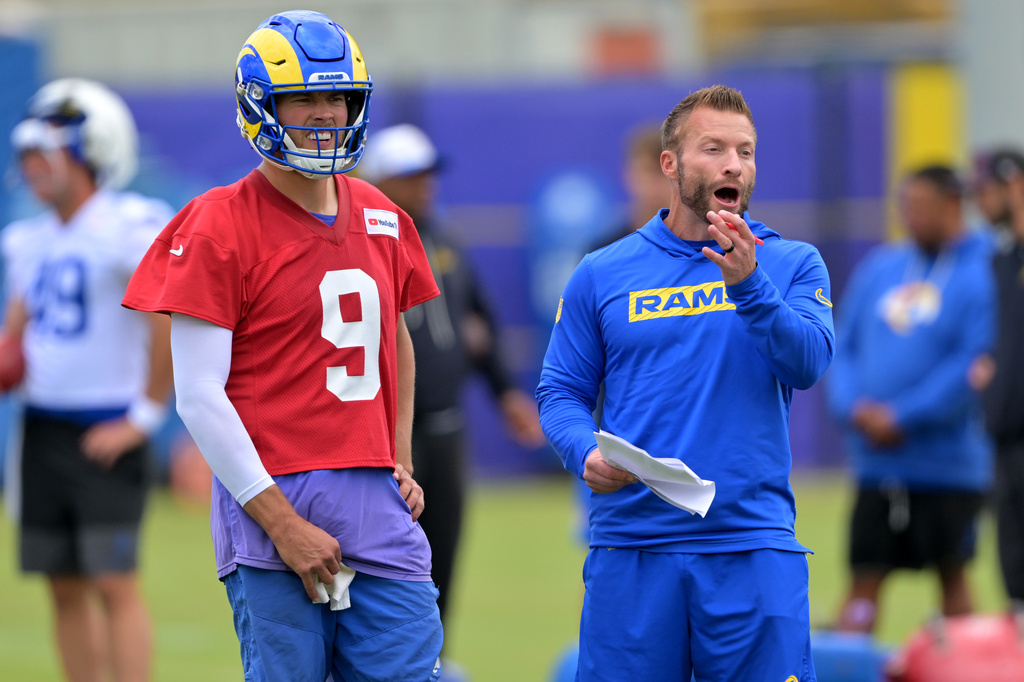 Los Angeles Rams quarterback Matthew Stafford (9) and head coach Sean McVay discuss a play during the NFL football team's practice Thursday, May 28, 2026, in Los Angeles. (AP Photo/Jayne Kamin-Oncea)