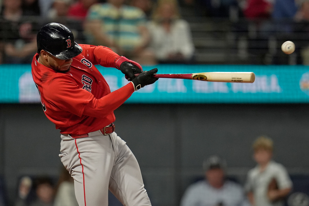Boston Red Sox's Willson Contreras singles in the eighth inning of a baseball game against the Cleveland Guardians in Cleveland, Friday, May 29, 2026. (AP Photo/Sue Ogrocki)