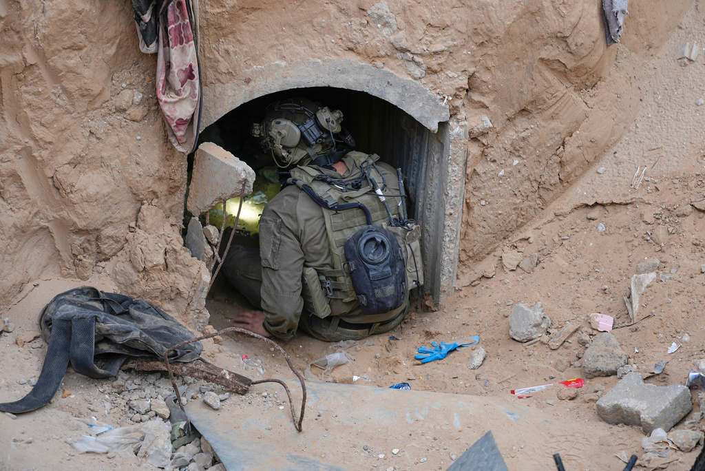 An Israeli soldier enters a tunnel where the army says the body of soldier Hadar Goldin was held in Rafah, Gaza Strip, Monday, Dec. 8, 2025. Hamas returned his remains to Israel as part of the current ceasefire. (AP Photo/Sam Mednick)