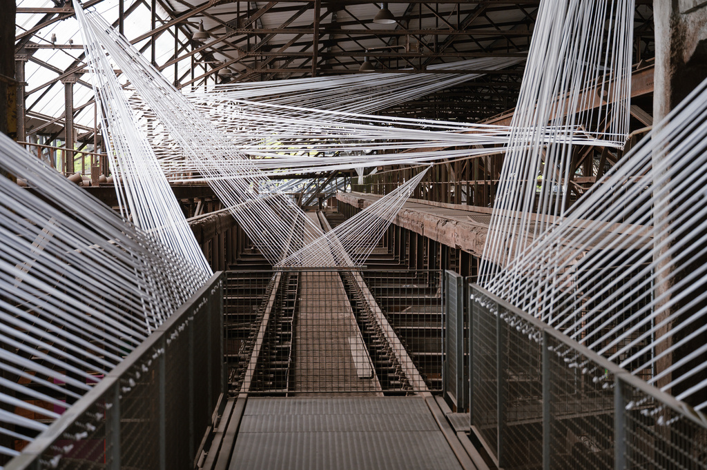 The installation "Transit der Erinnerung", Transit of Memory, by artist Vortex-X is on display at the at the former ironworks Voelklinger Huette, World Cultural Heritage Site, as part of the exhibition Urban Art Biennale 2026 in Voelklingen, Germany, Wednesday, May 6, 2026. (Oliver Dietze/dpa via AP)