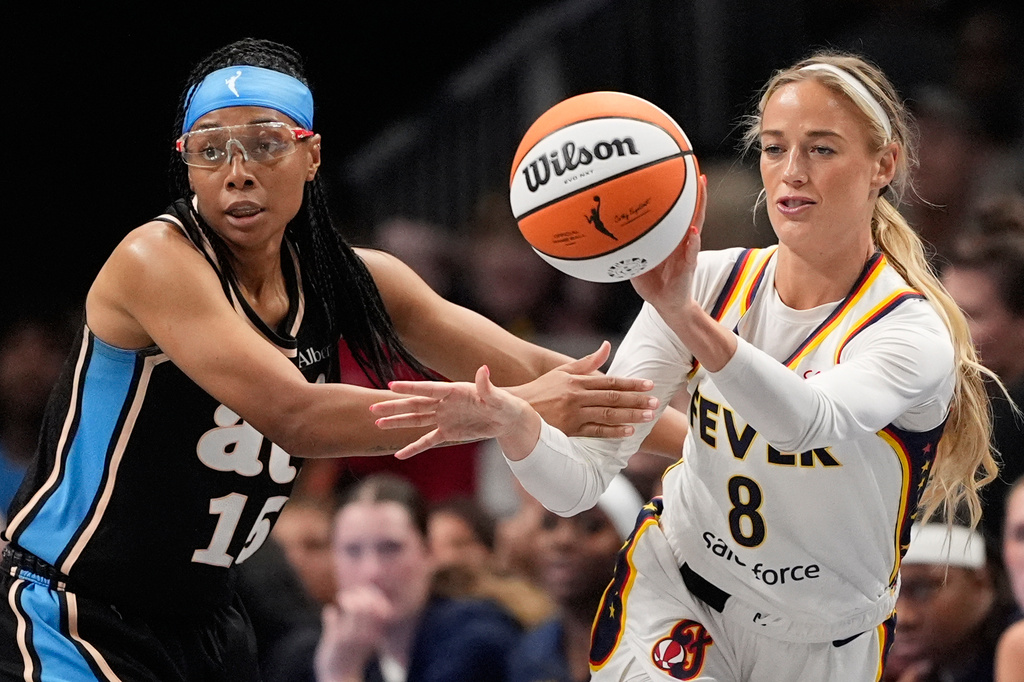 Indiana Fever guard Sophie Cunningham (8) passes in the first half of an WNBA basketball game against the Atlanta Dream Sunday, Aug. 16, 2026, in Atlanta. (AP Photo/Brynn Anderson)