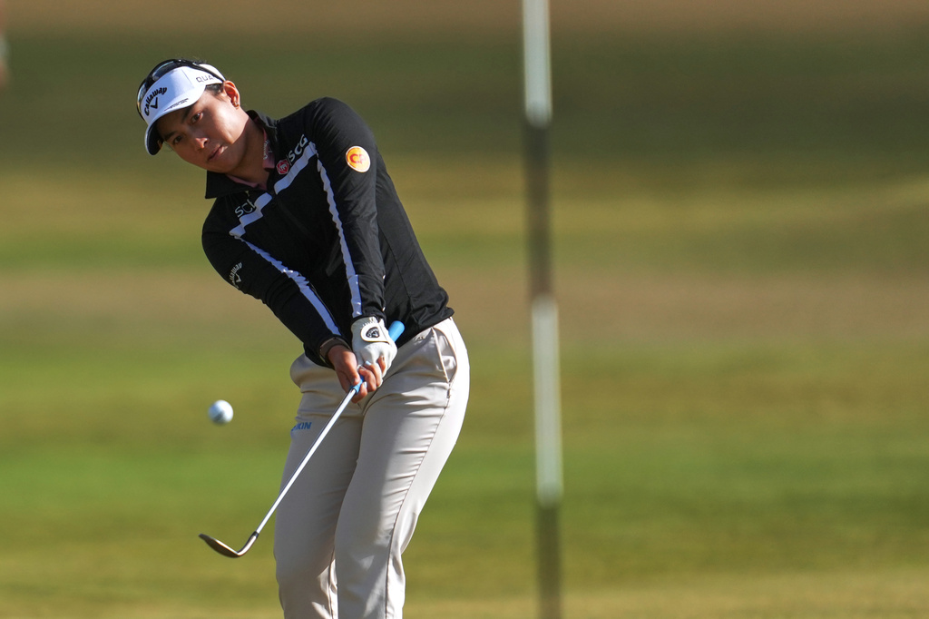 Jeeno Thitikul, of Thailand, chips onto the 14th green during the first round of the Women's British Open golf championship in Lytham St Annes, England, Thursday, July 30, 2026. (AP Photo/Jon Super)