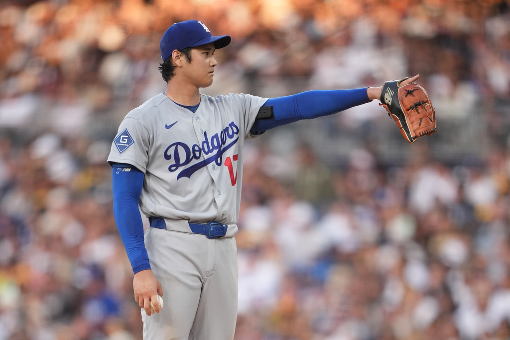 Los Angeles Dodgers starting pitcher Shohei Ohtani gestures as he works against a San Diego Padres batter during the fifth inning of a baseball game Wednesday, May 20, 2026, in San Diego. (AP Photo/Gregory Bull)