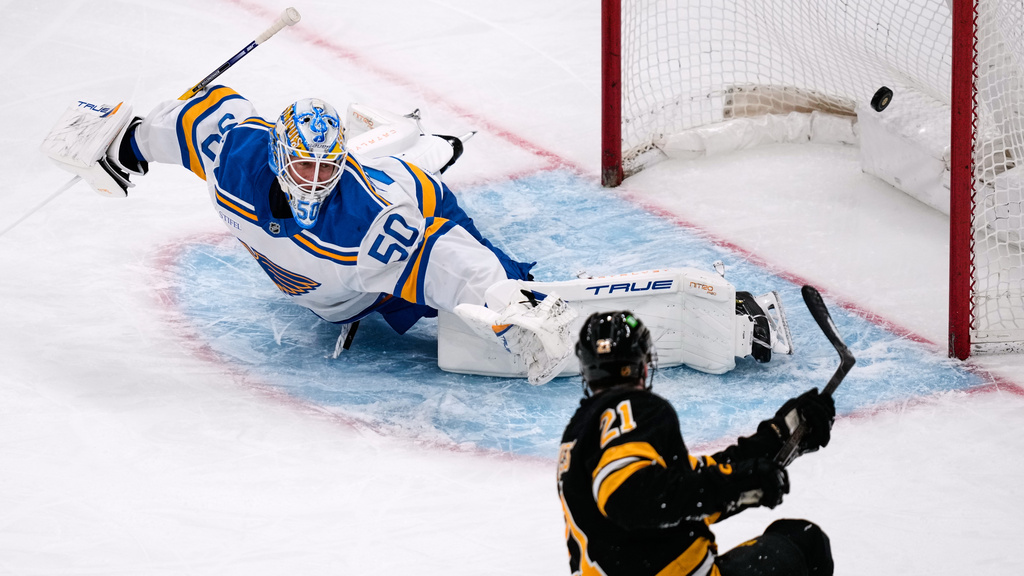 Boston Bruins center Alex Steeves (21) scores on St. Louis Blues goaltender Jordan Binnington during the first period of an NHL hockey game, Thursday, Dec. 4, 2025, in Boston. (AP Photo/Charles Krupa)