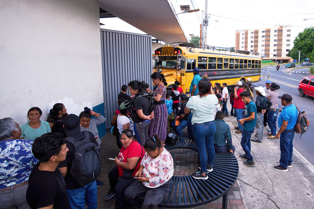 FILE - People wait for loved ones from Guatemala deported from the United States outside La Aurora International Airport, in Guatemala City, Aug. 31, 2025. (AP Photo/Moises Castillo, File)
