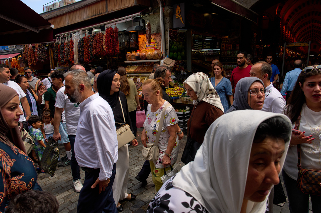 People crowd a street in Istanbul's Eminonu commercial district, Tuesday, Aug. 11, 2026. (AP Photo/Francisco Seco)