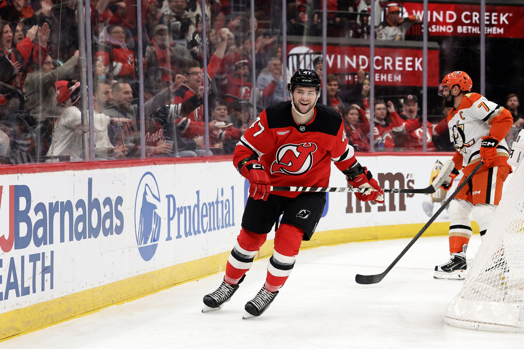 New Jersey Devils left wing Paul Cotter (47) reacts after scoring a goal during the second period of an NHL hockey game against the Anaheim Ducks, Saturday, Dec. 13, 2025, in Newark, N.J. (AP Photo/Adam Hunger)