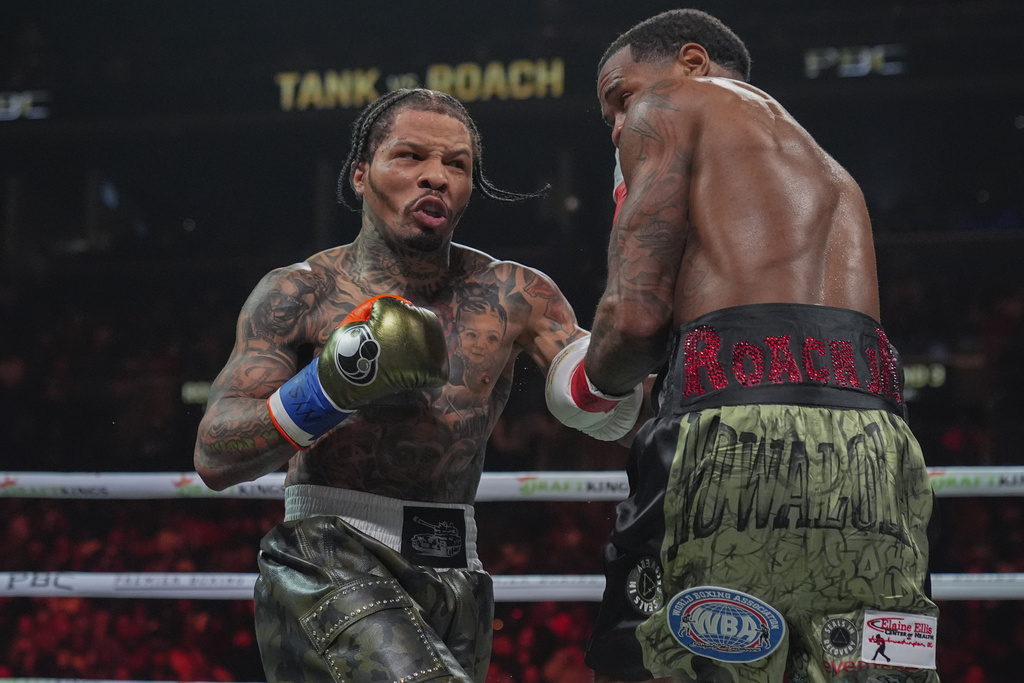 FILE - Gervonta Davis, left, punches Lamont Roach during the third round of a WBA lightweight championship boxing bout on March 1, 2025, in New York. (AP Photo/Frank Franklin II, File)