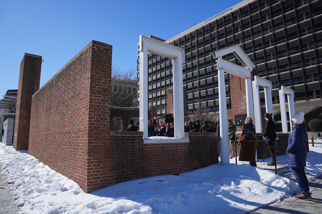 U.S. District Judge Cynthia Rufe, at threshold, inspects the location of the now removed explanatory panels that were part of an exhibit on slavery at President's House Site in Philadelphia, Monday, Feb. 2, 2026. (AP Photo/Matt Rourke)
