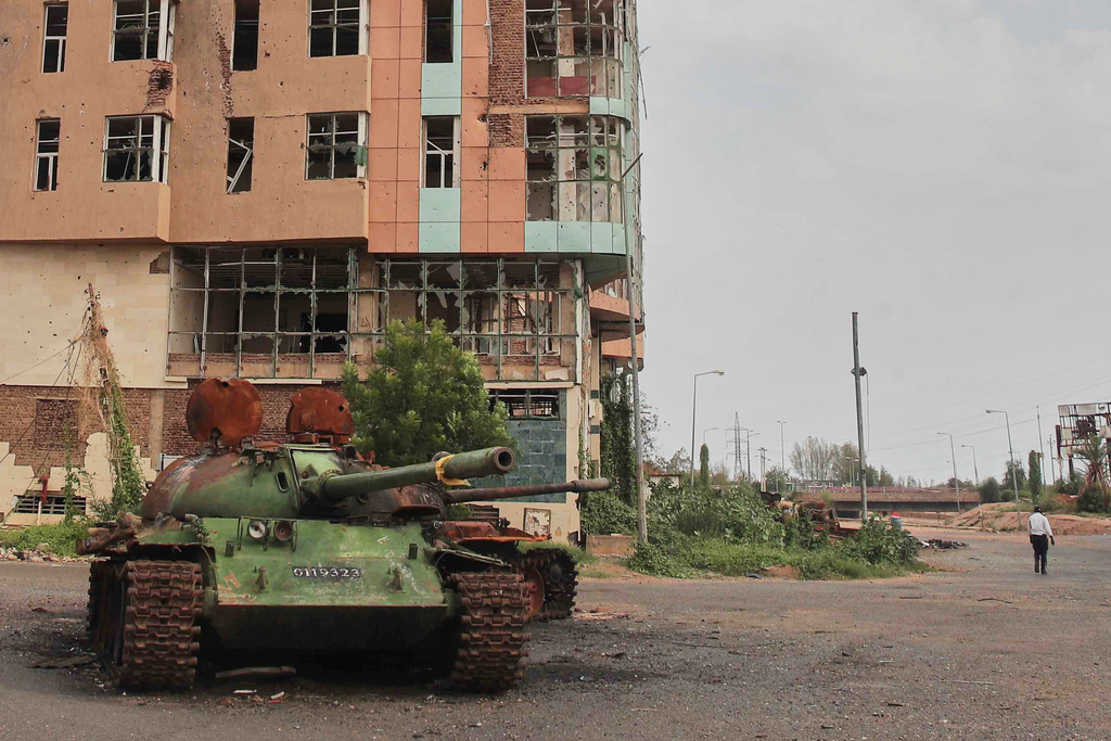 A destroyed tank, a remnant from fighting between the Sudanese Armed Forces (SAF) and the paramilitary Rapid Support Forces (RSF), in Khartoum, Sudan, Monday, Aug. 11, 2025. (AP Photo/Marwan Ali)
