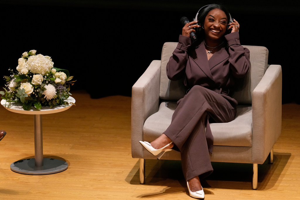 FILE - U.S. gymnast Simone Biles smiles during her motivational talk at the municipal building in Buenos Aires, on the occasion of Argentina's capital being declared the World Capital of Sport 2027 by the ACES, Wednesday, Oct. 8, 2025. (AP Photo/Natacha Pisarenko, File)