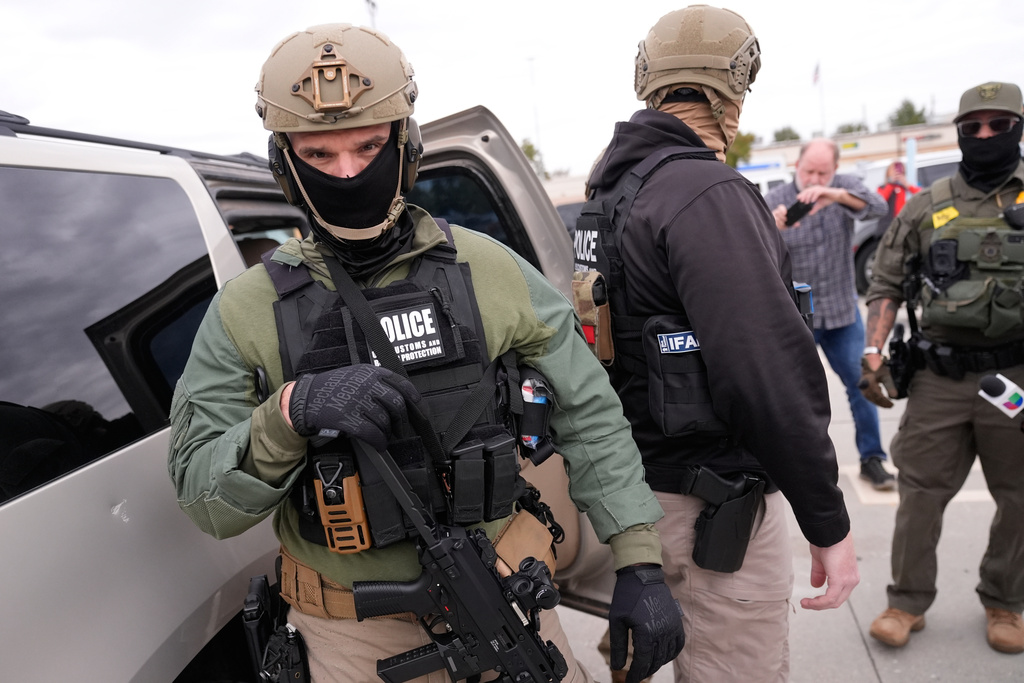 U.S. Border Patrol agents arrive at a Home Depot in Kenner, La.,Wednesday, Dec. 3, 2025. (AP Photo/Gerald Herbert)