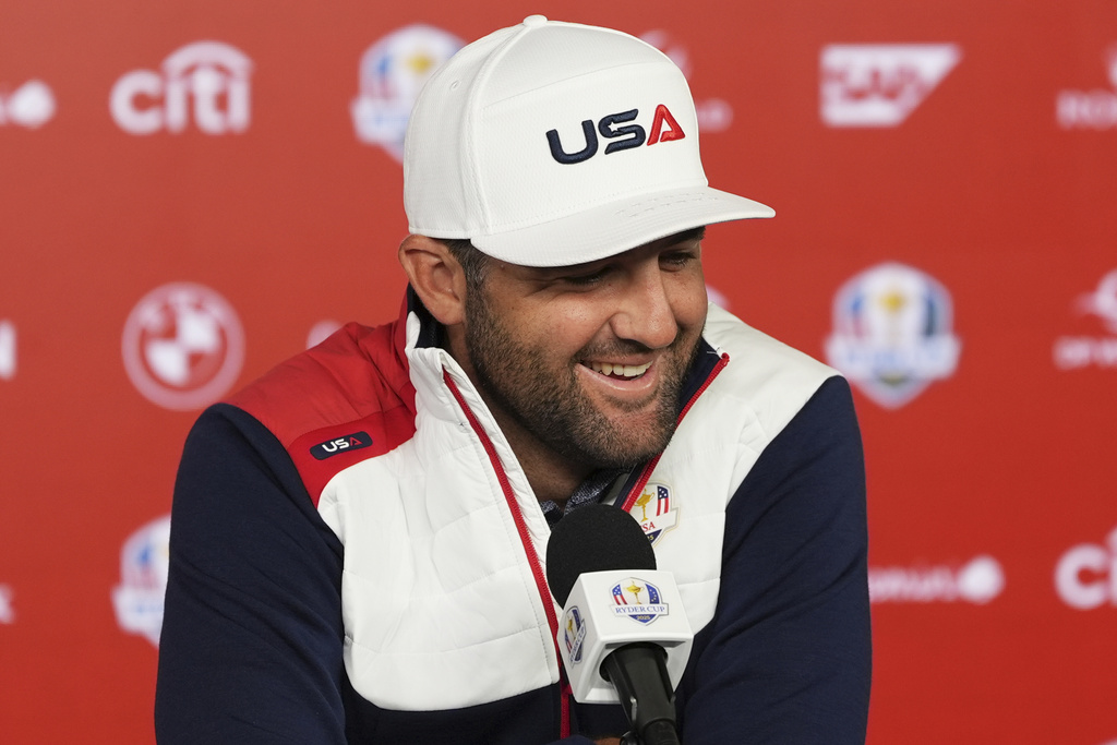 United States' Scottie Scheffler speaks during a news conference before a practice round at the Ryder Cup golf tournament, Tuesday, Sept. 23, 2025, in Farmingdale, N.Y., at Bethpage State Park's Black Course between the United States and Europe. (AP Photo/Lindsey Wasson)