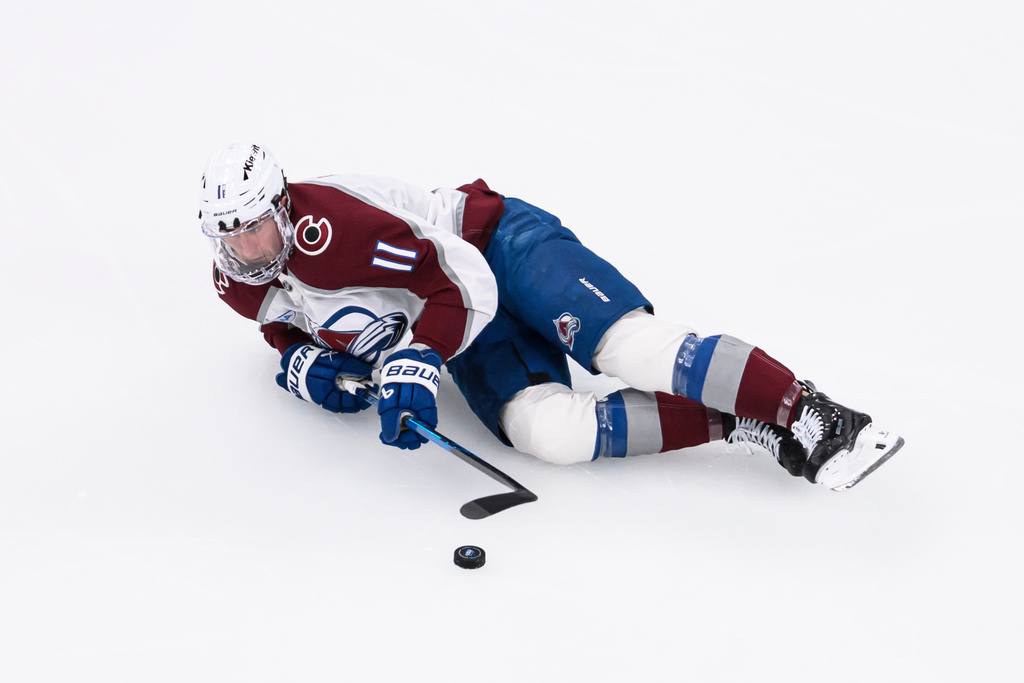 Colorado Avalanche center Brock Nelson plays the puck during the second period of an NHL hockey game against the Utah Mammoth, Wednesday, Feb. 25, 2026, in Salt Lake City. (AP Photo/Tyler Tate)