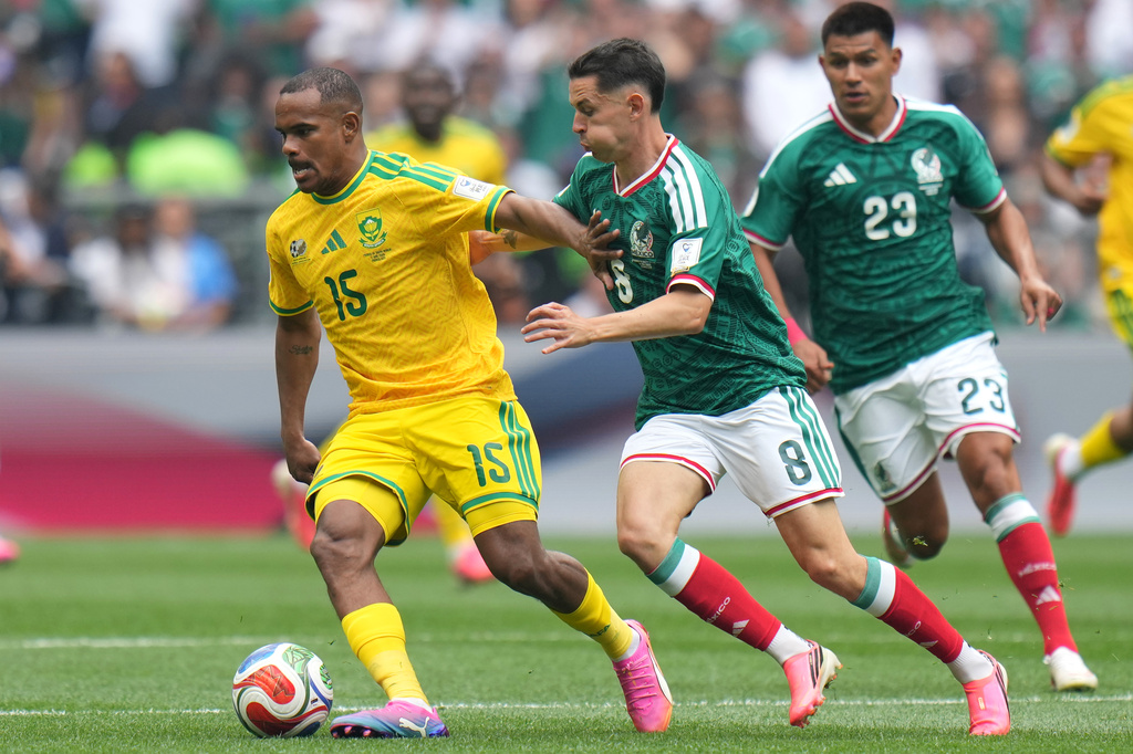 South Africa's Iqraam Rayners, left, controls the ball against Mexico's Alvaro Fidalgo during the first half in the World Cup Group A soccer match between Mexico and South Africa in Mexico City, Thursday, June 11, 2026. (AP Photo/Eduardo Verdugo)