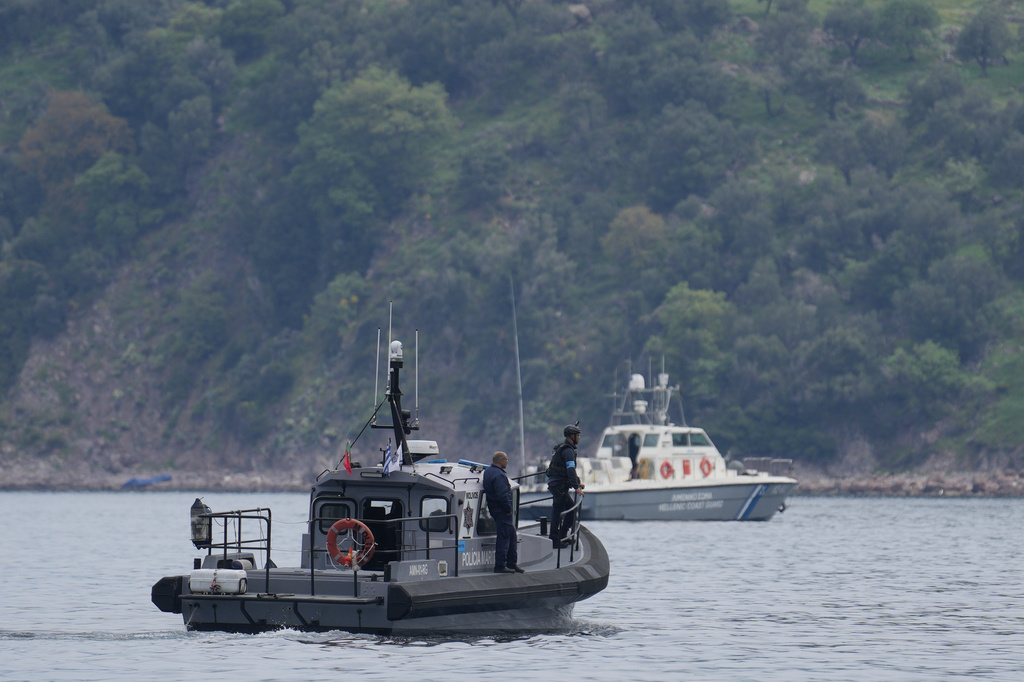 FILE - Frontex, foreground, and Greek coast guard vessels take part in a search and rescue operation, after the capsizing of a boat carrying migrants, off the coast on the northeastern Aegean Sea island of Lesbos, Greece, on April 3, 2025. (AP Photo/Panagiotis Balaskas, File)
