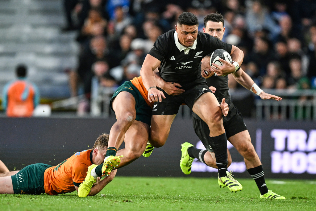 New Zealand's Caleb Clarke runs at the defence during the Bledisloe Rugby test between the All Blacks and the Wallabies at Eden Park in Auckland, New Zealand, Saturday, Sept. 27, 2025. (Andrew Cornaga/Photosport via AP)