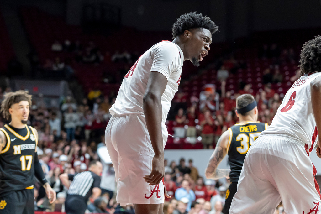 Alabama center Charles Bediako (14) cheers to his teammates after a score against Missouri during the second half of an NCAA college basketball game Tuesday, Jan. 27, 2026, in Tuscaloosa, Ala. (AP Photo/Vasha Hunt)