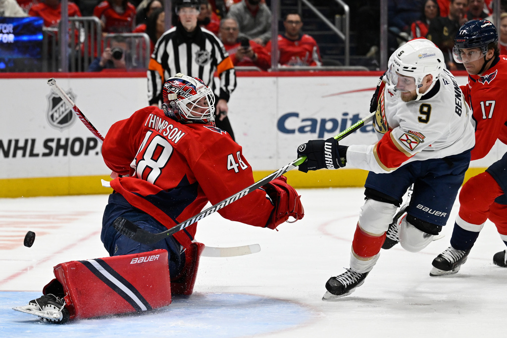 Florida Panthers center Sam Bennett (9) shoots the puck past Washington Capitals goaltender Logan Thompson for a goal during the second period of an NHL hockey game, Saturday, Jan. 17, 2026, in Washington. (AP Photo/John McDonnell)