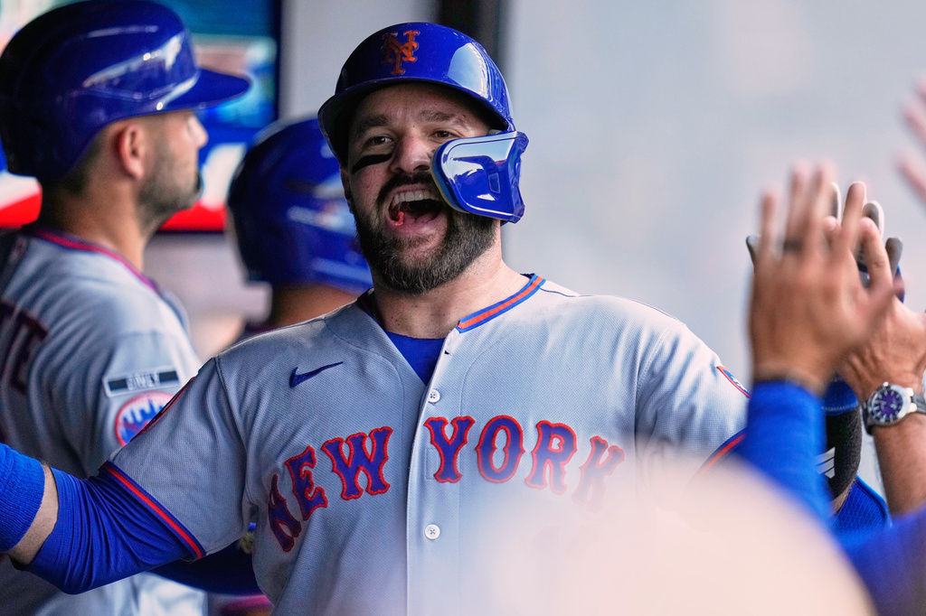 New York Mets' Luis Torrens (13) celebrates his home run in the second inning of a baseball game against the Cleveland Guardians in Cleveland, Tuesday, Aug. 4, 2026. (AP Photo/Sue Ogrocki)