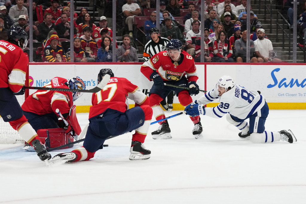 Florida Panthers goaltender Sergei Bobrovsky, left, defends a shot on the goal by Toronto Maple Leafs left wing Nicholas Robertson (89) during the first period of an NHL hockey game, Thursday, Feb. 26, 2026, in Sunrise, Fla. (AP Photo/Lynne Sladky)