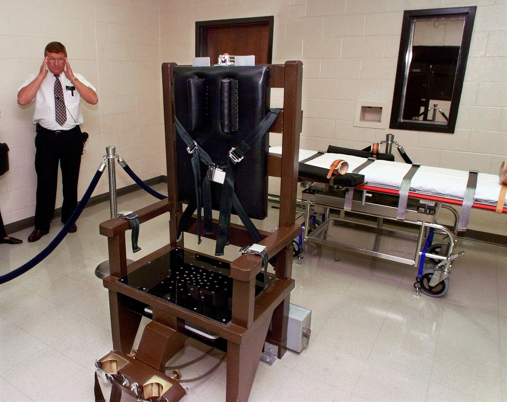 FILE - Ricky Bell, warden at Riverbend Maximum Security Institution in Nashville, Tenn., gives a tour of the prison's execution chamber, Oct. 13, 1999. (AP Photo/Mark Humphrey, File)