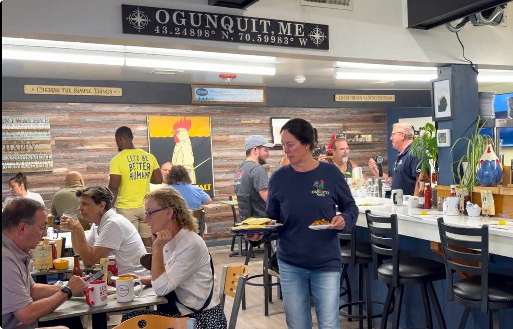 Breakfast is served at The Omelette Factory, a restaurant whose owners are in dispute with the town over large tin roosters, in Ogunquit, Maine, Wednesday, July 22, 2026. (AP Photo/Robert F. Bukaty)