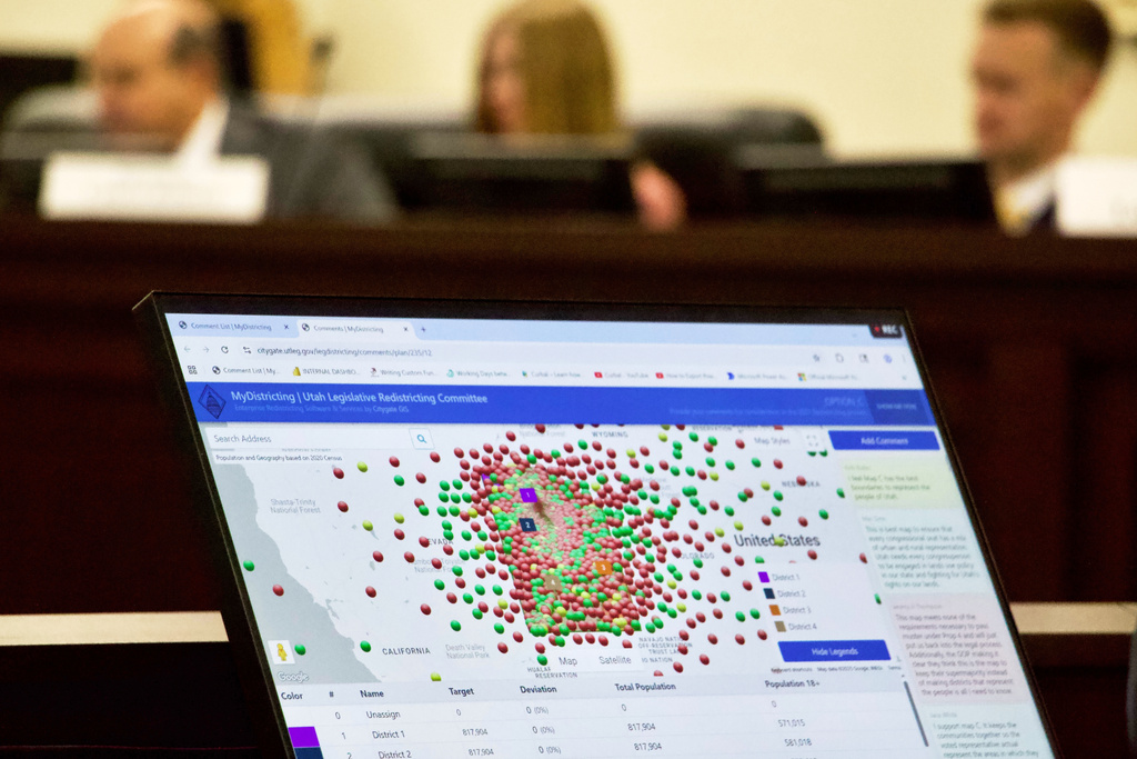 Lawmakers look at a display of public comments on their congressional redistricting proposals, Monday, Sept. 6, 2025, in Salt Lake City, Utah. (AP Photo/Hannah Schoenbaum)